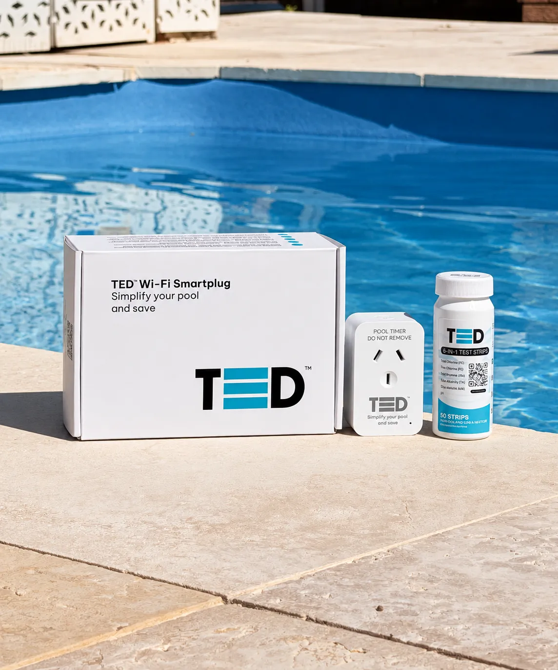 The TED smart plug, test strips and box on the edge of a clear backyard pool
